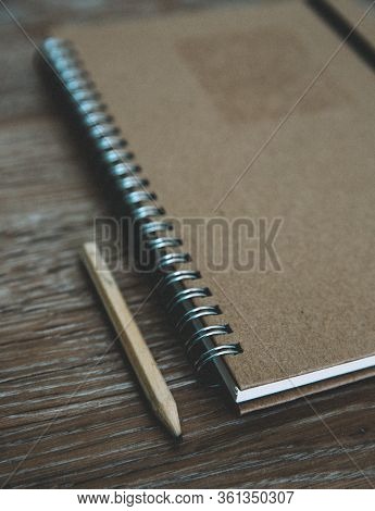 An Old Fashioned Desk Top With A Ring Binder Note Book And Pencil For Taking Notes And Creative Writ