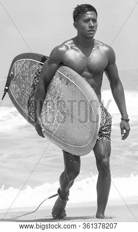 The Blurry Light Design Background Of Serfer Is Serfing On A Wave With Serf Board
