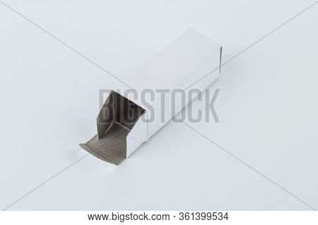 Close Up Of A Small White Cardboard Box , Isolated On White Background