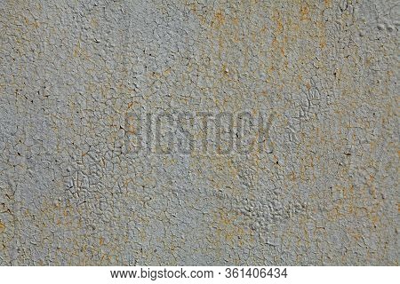 Metallic Wall Background, Texture. An Old Grey And Rusty Surface With Faded Uneven Color. Abstract M