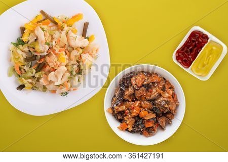 Pickled Vegetables On A White Plate. Vegetarian Food On A Yellw Background. Rustic Food.flat Lay