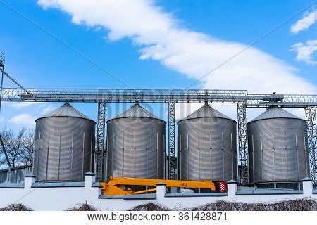 Beer Factory With Huge Reservoirs Behind The Fence