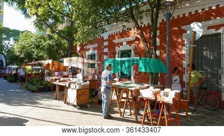Cordoba Argentina January 4 Setting Up A Book Stall In A Craft Market Of Guemes District, Located In
