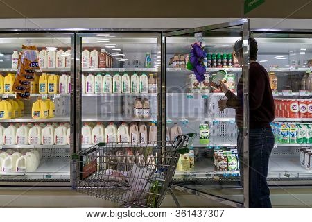 Empty Refrigerated Shelves At Publix Featuring Dairy Food Shortage Including Milk, Yogurt, And Sour