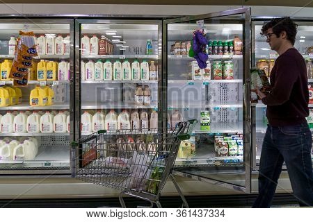 Empty Refrigerated Shelves At Publix Featuring Dairy Food Shortage Including Milk, Yogurt, And Sour