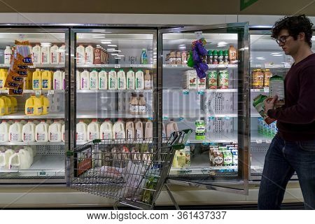 Empty Refrigerated Shelves At Publix Featuring Dairy Food Shortage Including Milk, Yogurt, And Sour