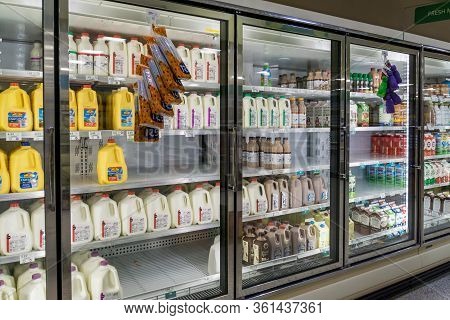 Empty Refrigerated Shelves At Publix Featuring Dairy Food Shortage Including Milk, Yogurt, And Sour