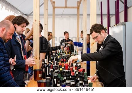 Alba, Italy - April 22, 2017 - Sommelier, And Tourists Tasting Traditional Wines Of Piedmont At Vinu