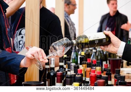 Alba, Italy - April 22, 2017 - Sommelier, And Tourists Tasting Traditional Wines Of Piedmont At Vinu