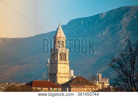 Saint Dominus Cathedral Belltower In Split,croatia Seen From A Distance Peeking Over The Rooftops Of