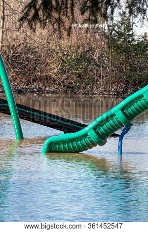 An Unintentional Water Slide In A Flooded Park
