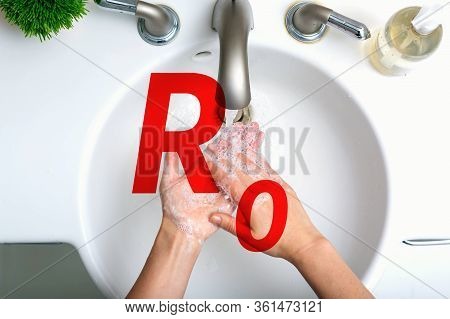 R Nought Theme With Person Washing Their Hands With Soap And Water