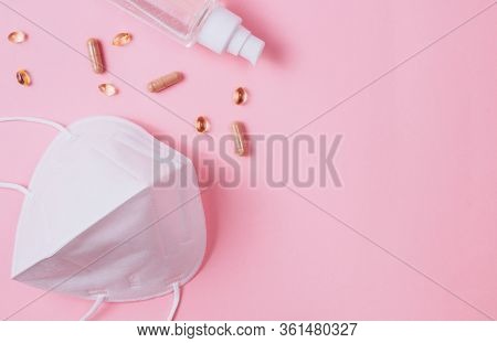 Flat Lay Of Medical Mask Kn95, Syringe, Hand Sanitizer Gel, Drops, Pills, Immunomodulating Supplemen