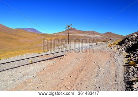 The Road And The Train Trucks Intertwined In The Pune Between Caipe And Socompa. Salta, Argentina
