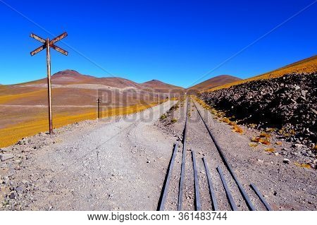 The Road And The Train Trucks Intertwined In The Pune Between Caipe And Socompa. Salta, Argentina