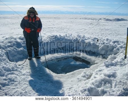 Lake Baikal, Russia - March 12, 2020: Rescue Divers Conduct Training Camps On Lake Baikal. Divers In