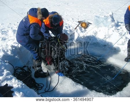 Lake Baikal, Russia - March 12, 2020: Rescue Divers Conduct Training Camps On Lake Baikal. Divers In
