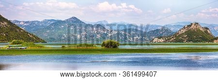 Awesome View Of Skadar Lake Surrounded By Green Mountain Peaks On A Sunny Day. Location: National Pa