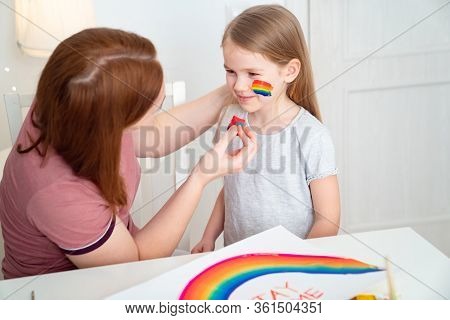 Redhead Mom Draws The Blonde Kid Daughter Of The Rainbow On Her Cheek. Stay Home. Flashmob Chasether