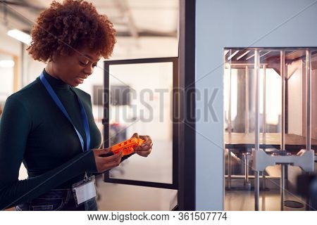 Female College Student Studying Engineering Using 3D Printing Machine