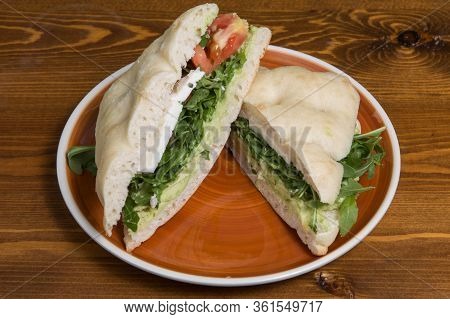 Ciabatta Baguette Sandwiches With Avocado, Cheese, Rucula And Tomato.