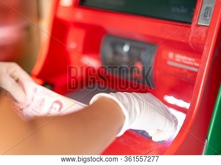 Female Hands To Press The Atm Key In The Red Cabinet.  Finger   Pressing A Pin Code On A Number Pad.