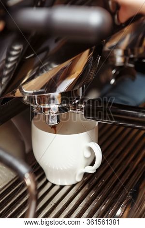 Espresso Machine Pouring Coffee In Cups. Barista Making Fresh Coffee Latte.