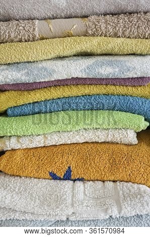 Stack Of Multicolored Towels Neatly Folded Photo