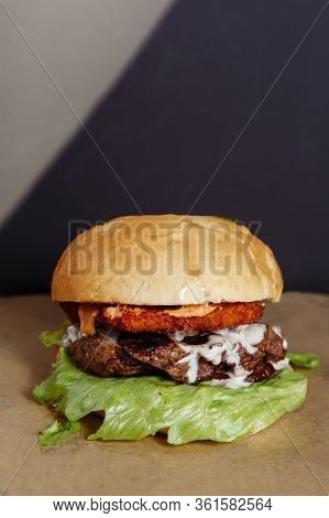 Juicy Burger With Chicken And Lamb Meat On A Dark Background
