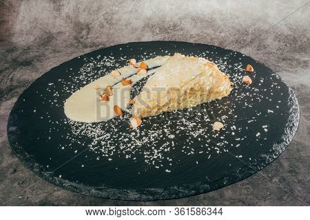 Cake With Almonds And Coconut Shvings On Top