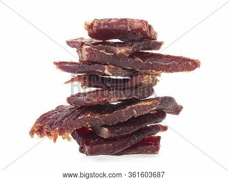 Beef Jerky Pieces Isolated On A White Background. Portion Of Beef Jerky.