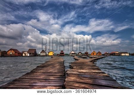 Bokod Floating Village With Piers And Fishing Wooden Cottages, In One Windy Morning. Bokod Lake, Hun