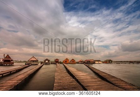 Bokod Floating Village With Piers And Fishing Wooden Cottages, In One Windy Morning. Bokod Lake, Hun