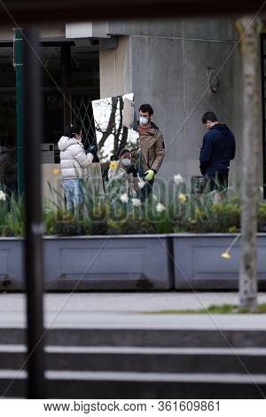 Downtown Vancouver, Bc, Canada - Apr 01, 2020: Pedestrian In Downtown Vancouver Wearing A Medical Fa