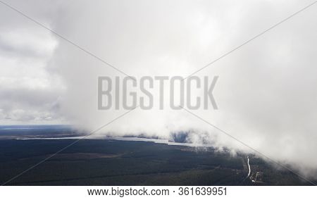 Aerial Image Of Dark Storm Clouds Over The Land. Aerial Panorama Of Storm Clouds. Panorama Of Thunde