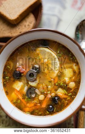 Ceramic Plate With Soup Solyanka, Russian Hodgepodge Soup With Olives And Lemon
