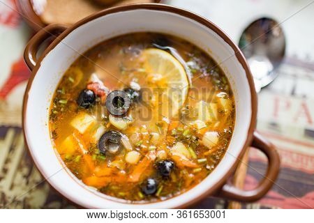 Ceramic Plate With Soup Solyanka, Russian Hodgepodge Soup With Olives And Lemon