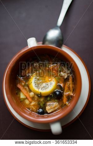 Ceramic Plate With Soup Solyanka, Russian Hodgepodge Soup With Olives And Lemon