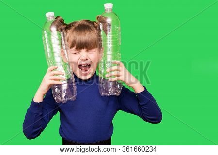 Little Girl Holding Plastic Bottles With Close Eyes And Screams For Help In Protecting Our Planet Fr
