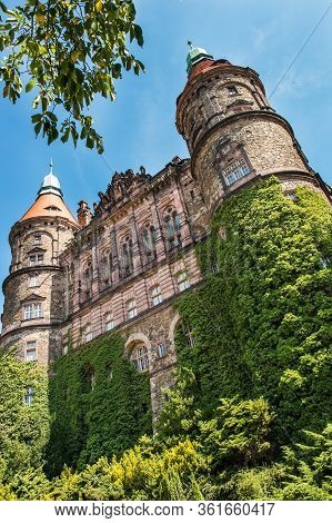 The Western Facade Of Ksiaz Castle With Two Towers In Walbrzych City, Poland. The Castle Was Built I