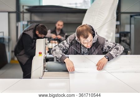 Technician Glue Poster To Foam With Semi Automatic Gluing Machine