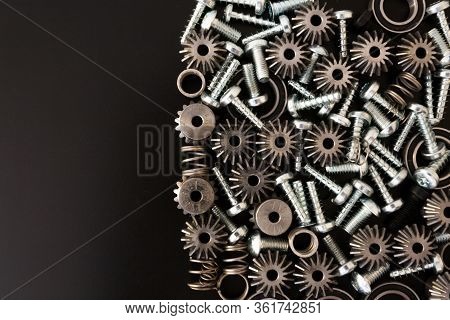 Mechanical Components On Black Background. Industrial Objects