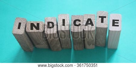 Indicate Word On Wooden Blocks On Cyan Background. Financial Indicator Unsecured And Secured Bonds O