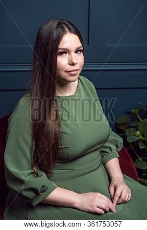 Confident Plump Woman In A Beautiful Evening Dress With Neckline And Natural Makeup