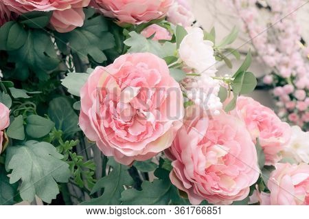 Large Pink Artificial Peonies Flowers On The Wall. Delicate Floral Texture Background For Wedding Sc