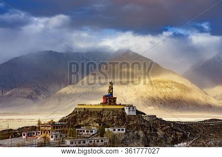 The Maitreya Buddha Statue With Himalaya Mountains In The Background From Diskit Monastery Or Diskit