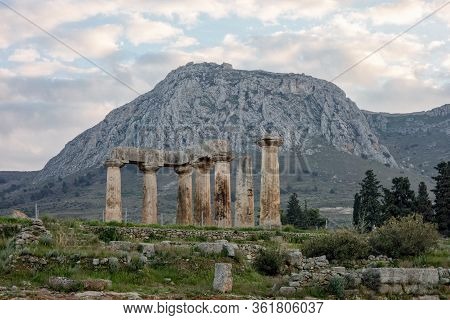 Archaological Site Of Corinth And Temple Of Apollo After Sunset In Greece