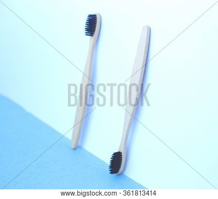 Zero Waste Concept. Bamboo Toothbrushes On A White-blue Background