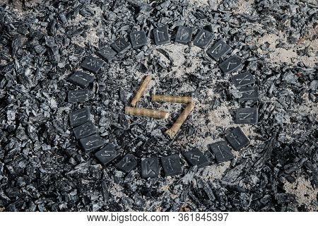 Norse Rune Yera On Ashes Backgorund Inside The Circle Of 24 Norse Runes