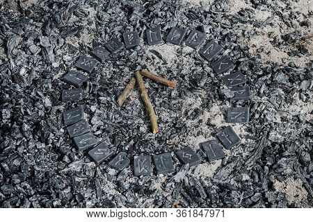 Norse Rune Teihwaz On Ashes Backgorund Inside The Circle Of 24 Norse Runes